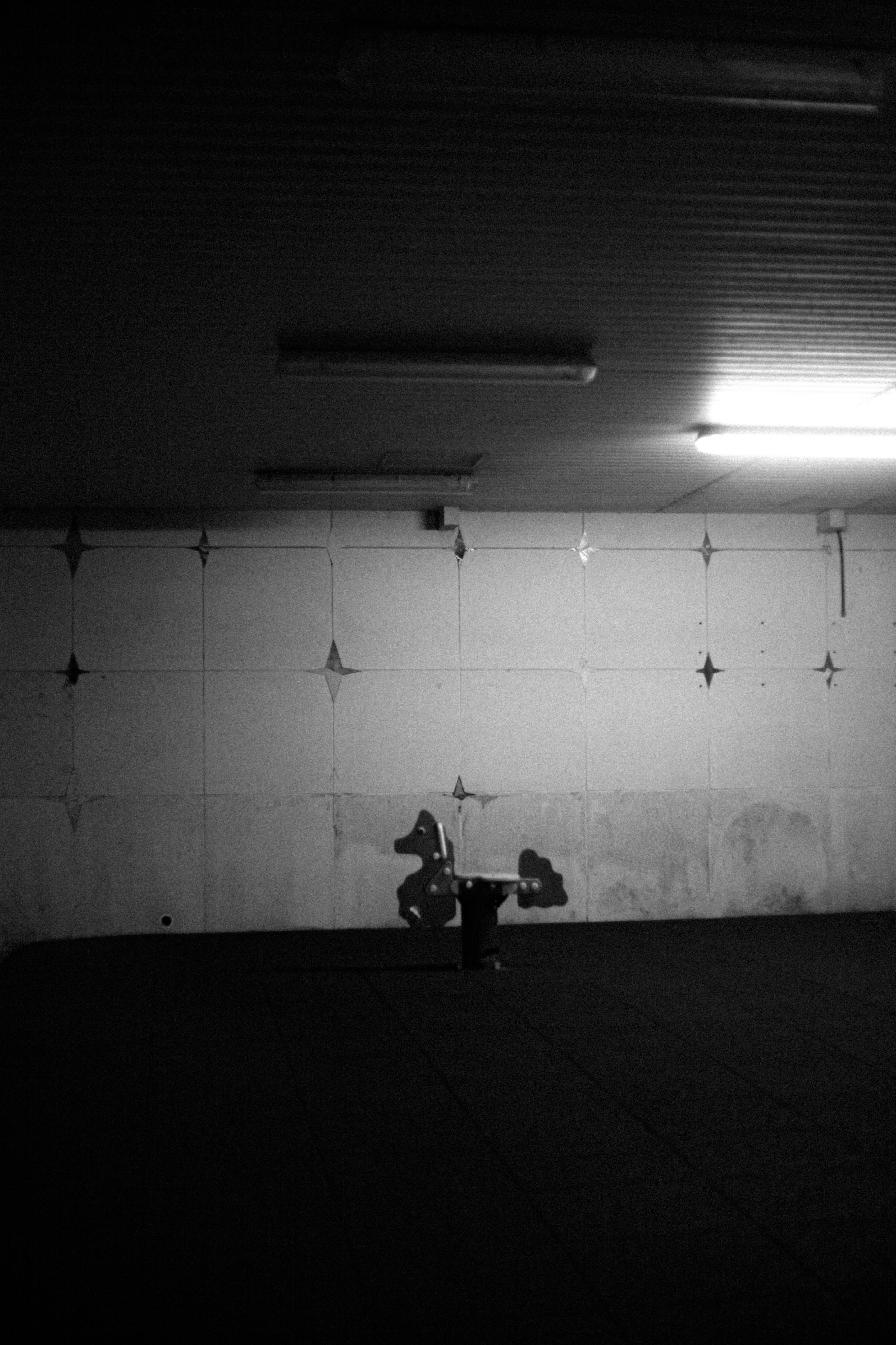 A black and white photo of a parking garage