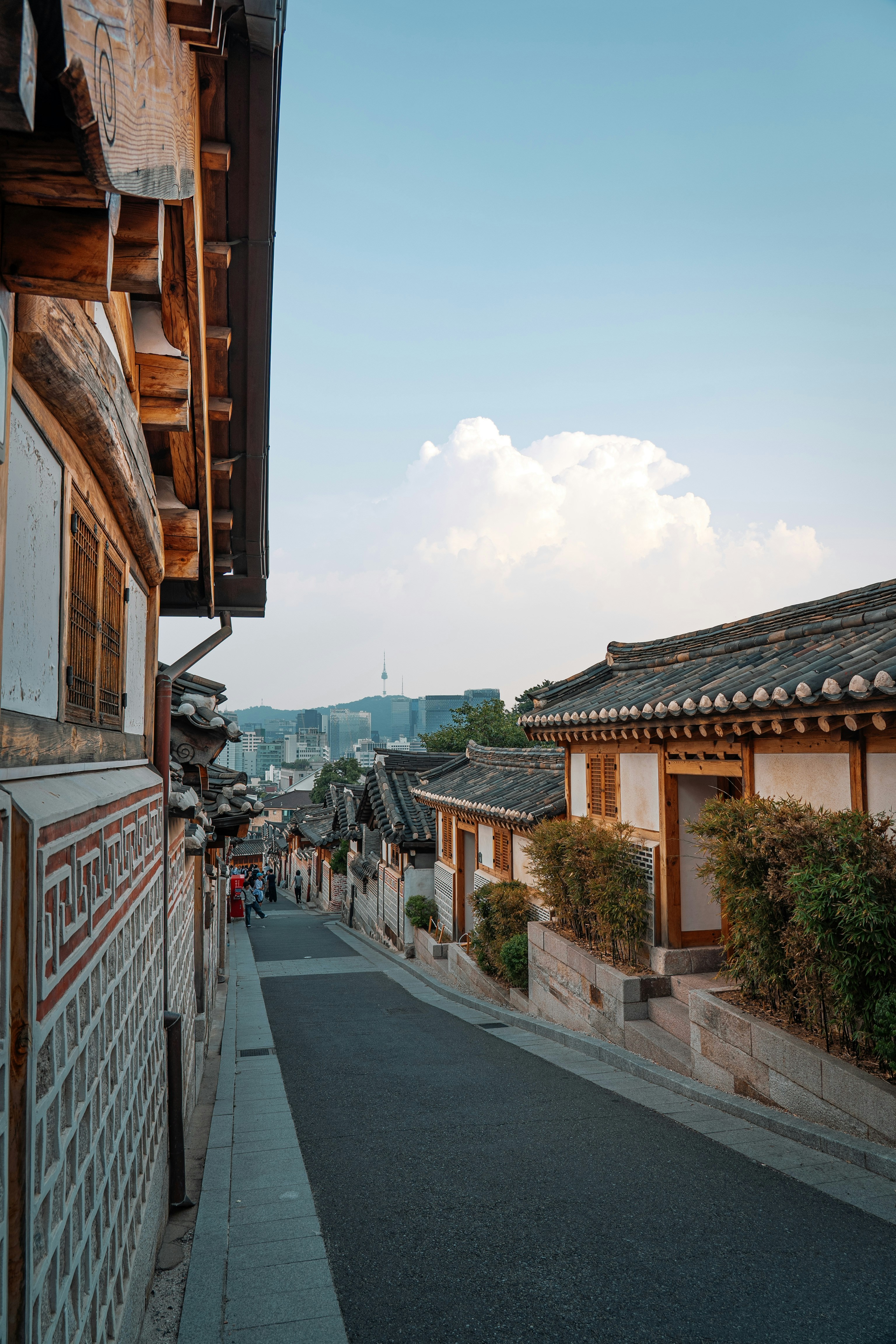 A narrow street lined with wooden buildings
