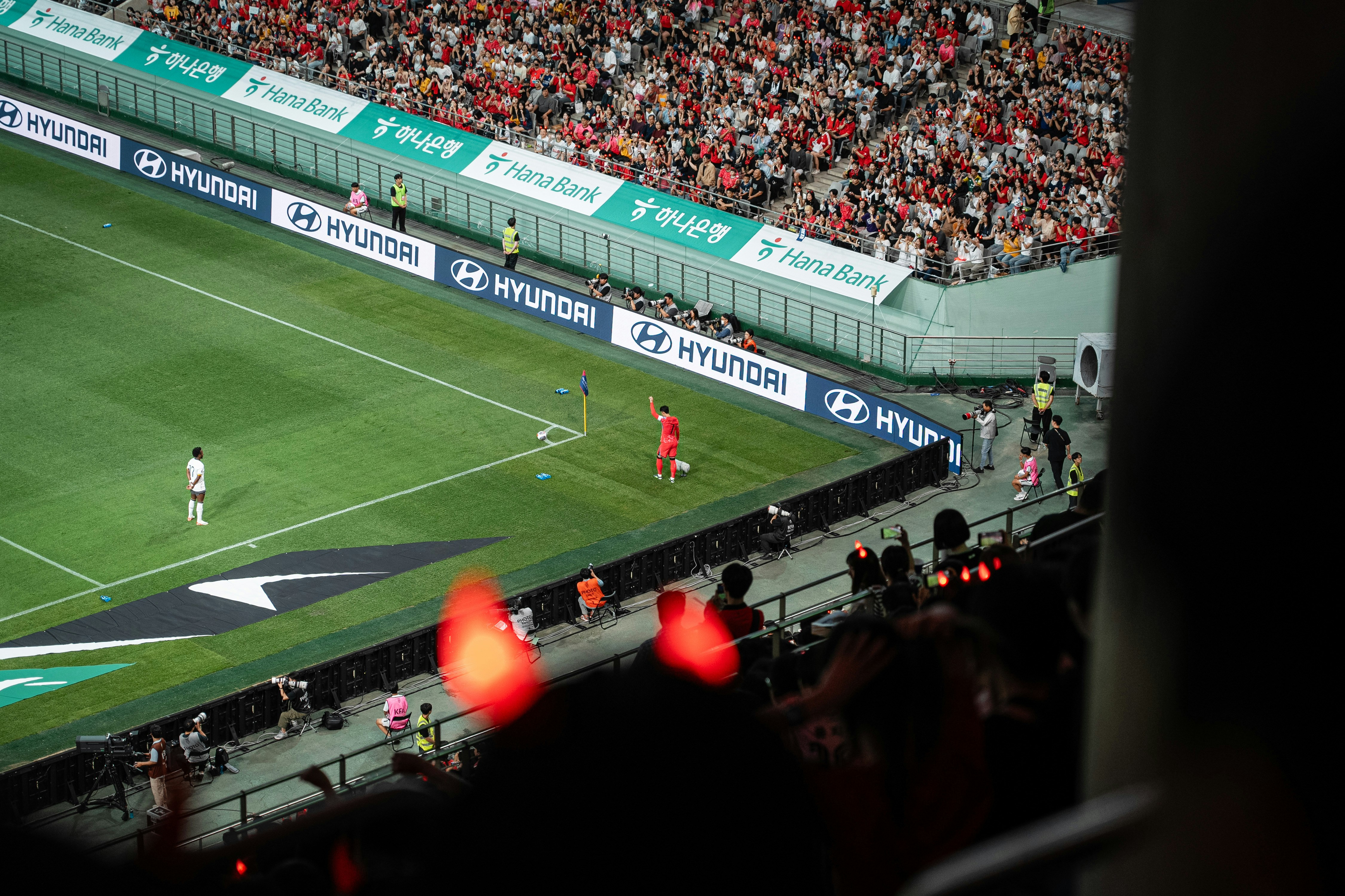 A crowd of people watching a soccer game