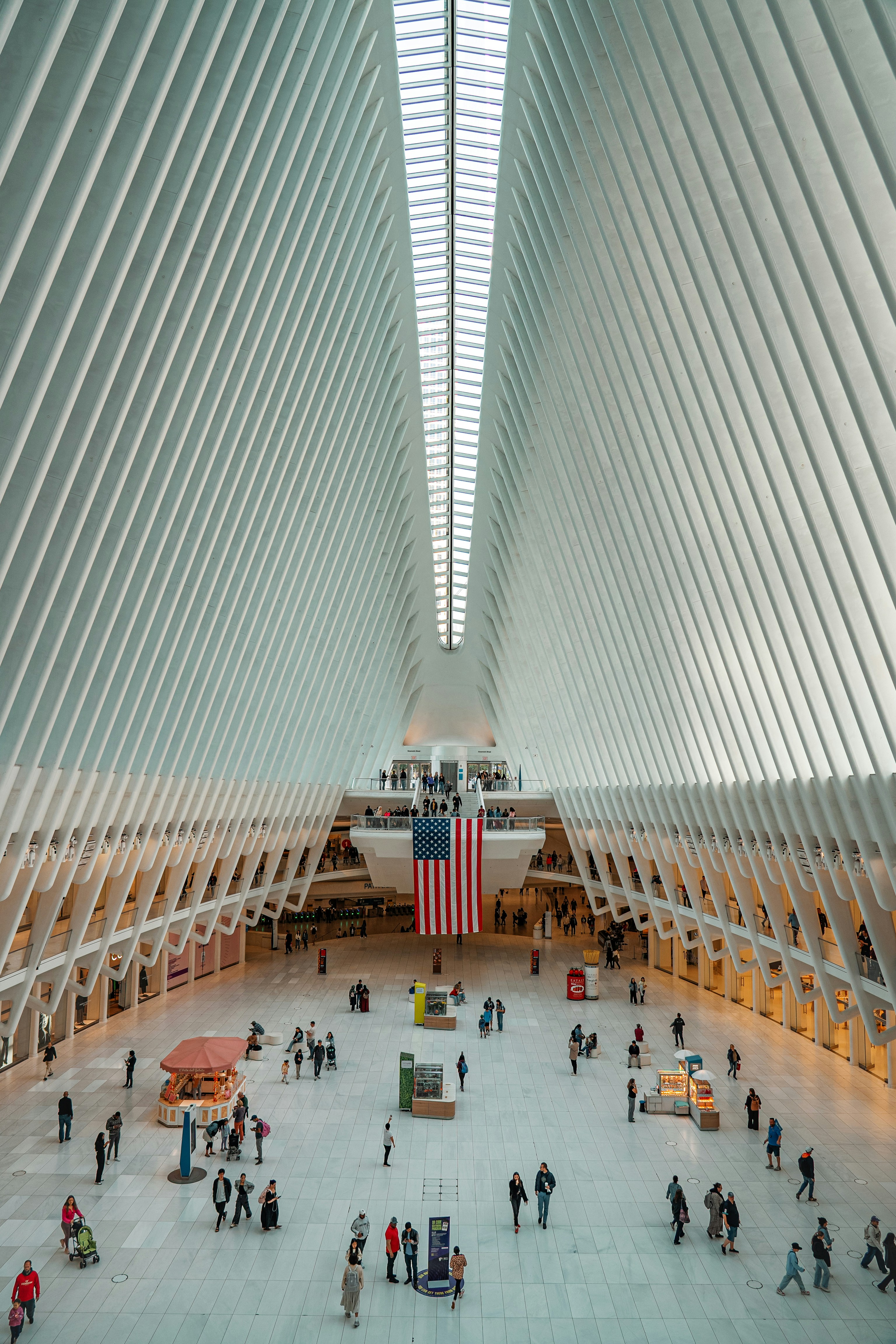 A group of people standing inside of a building
