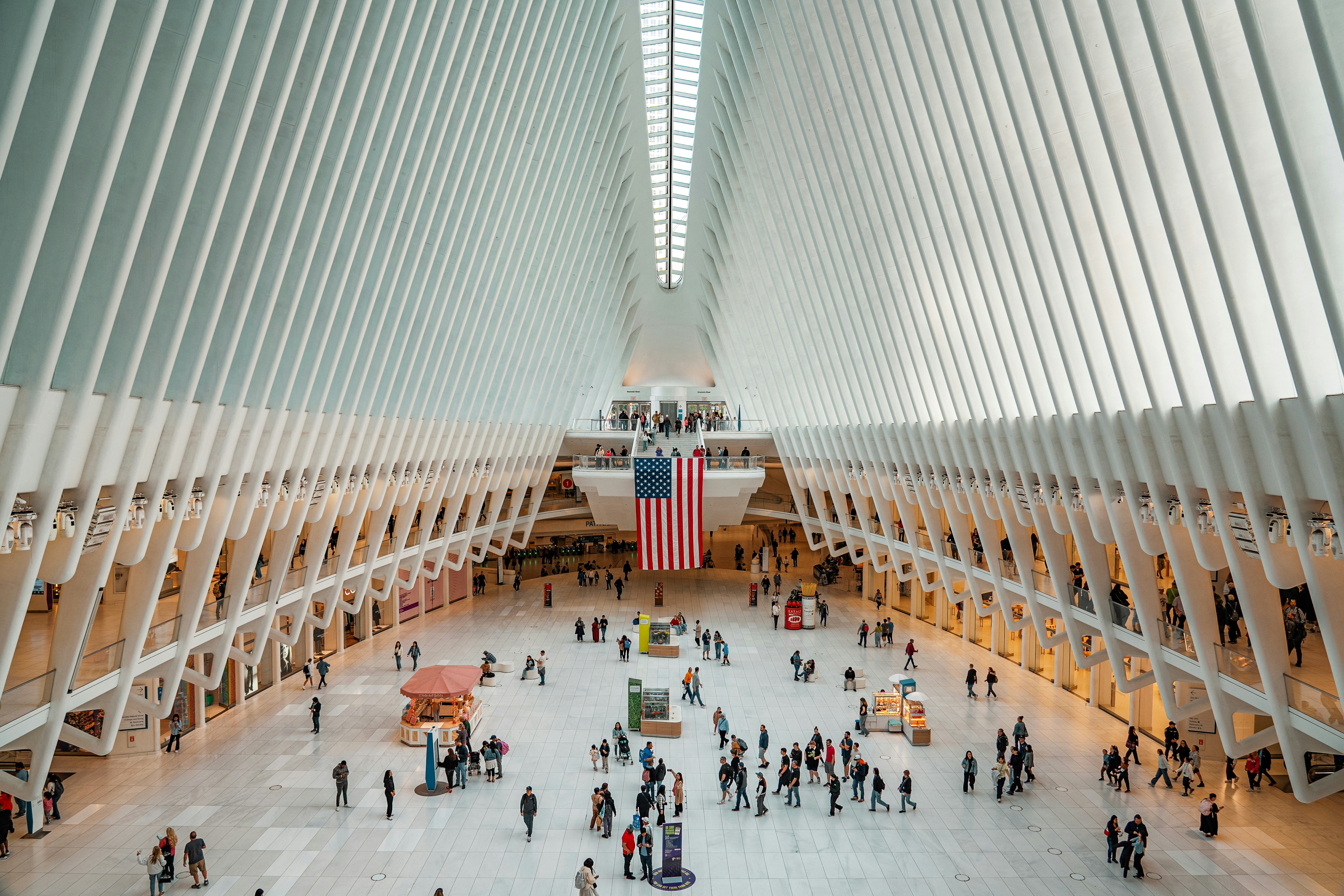 A group of people standing inside of a building