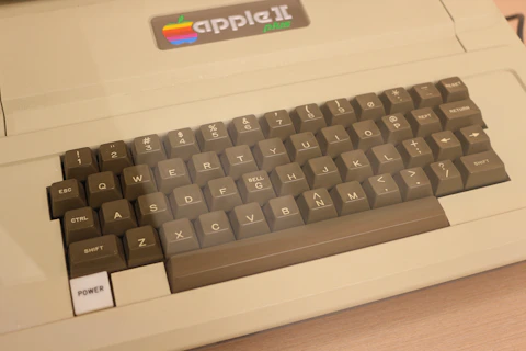 A computer keyboard sitting on top of a desk