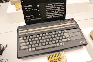 A laptop computer sitting on top of a white desk