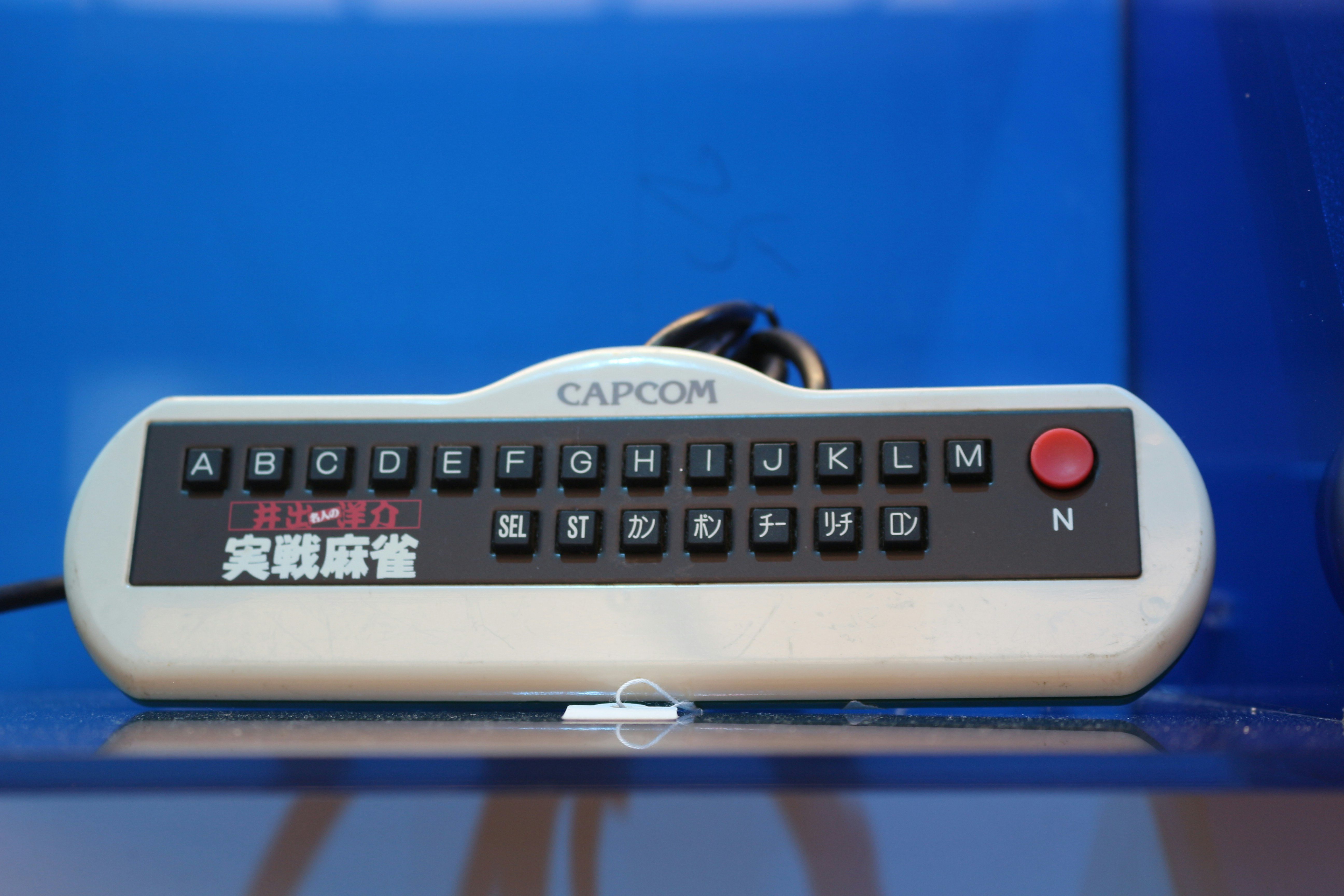 A remote control sitting on top of a table