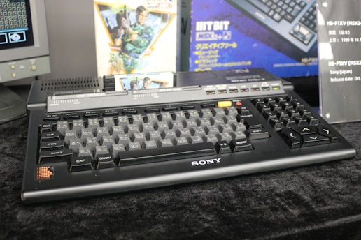 A computer keyboard sitting on top of a desk