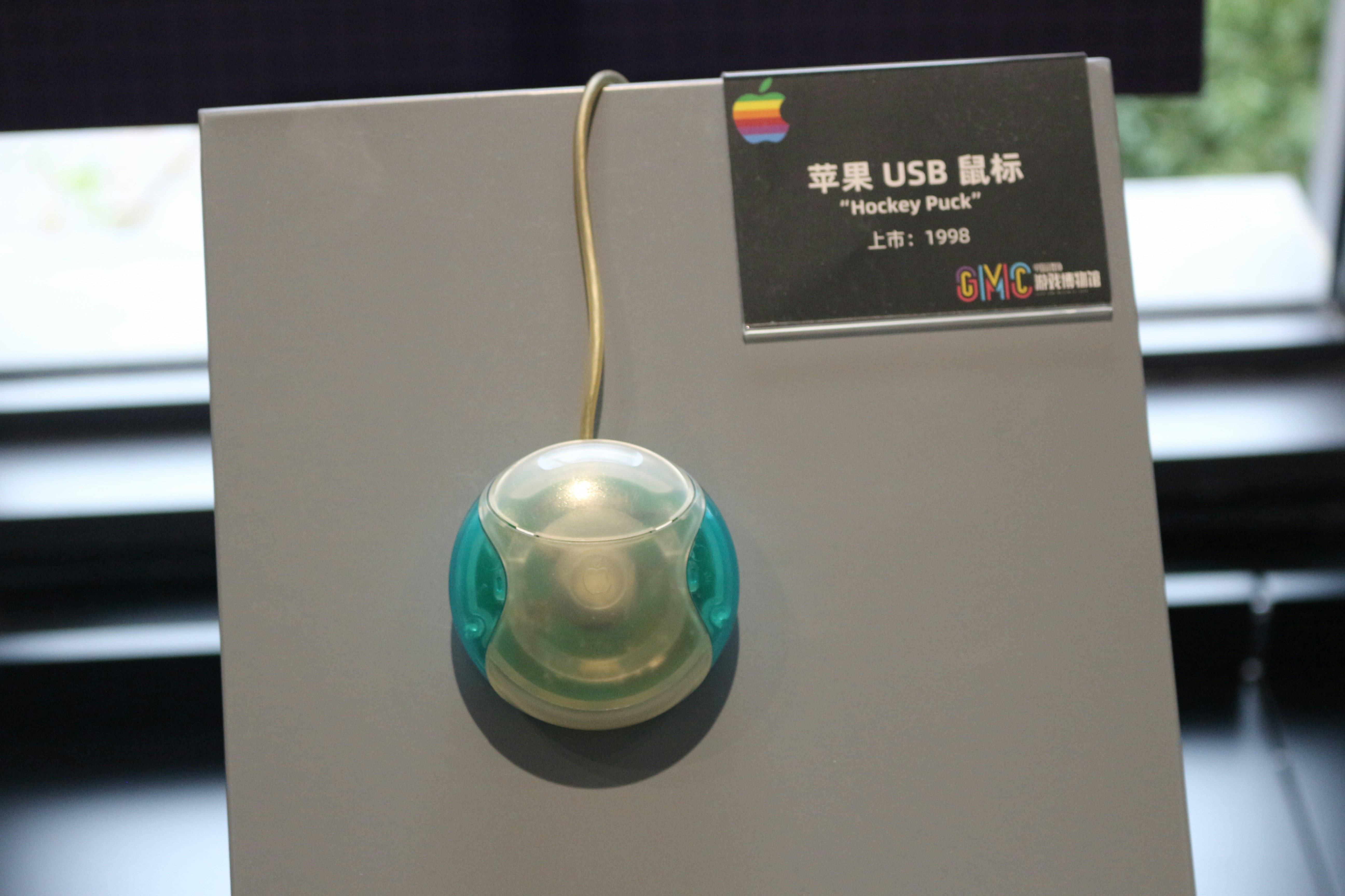 A white box with a green light inside of it