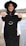 A woman holding up a t - shirt with a smiley face on it