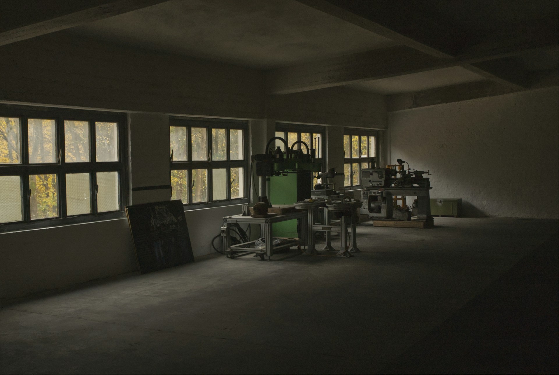 A room with a lot of windows and chairs