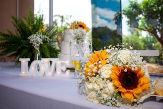 A bouquet of sunflowers sits on a table