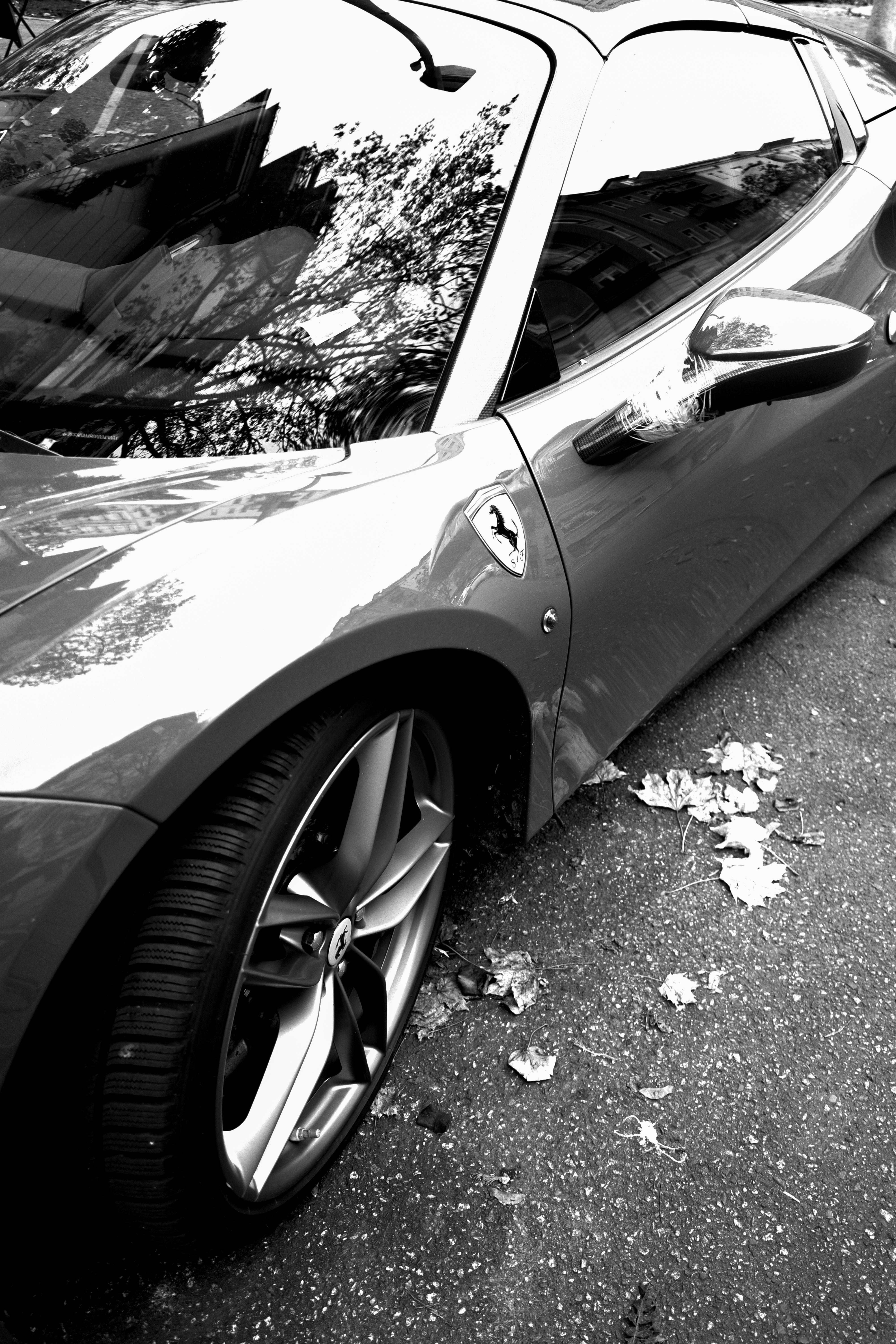 White supercar close-up on polished panel, paint correction result, crisp reflections, dark studio environment