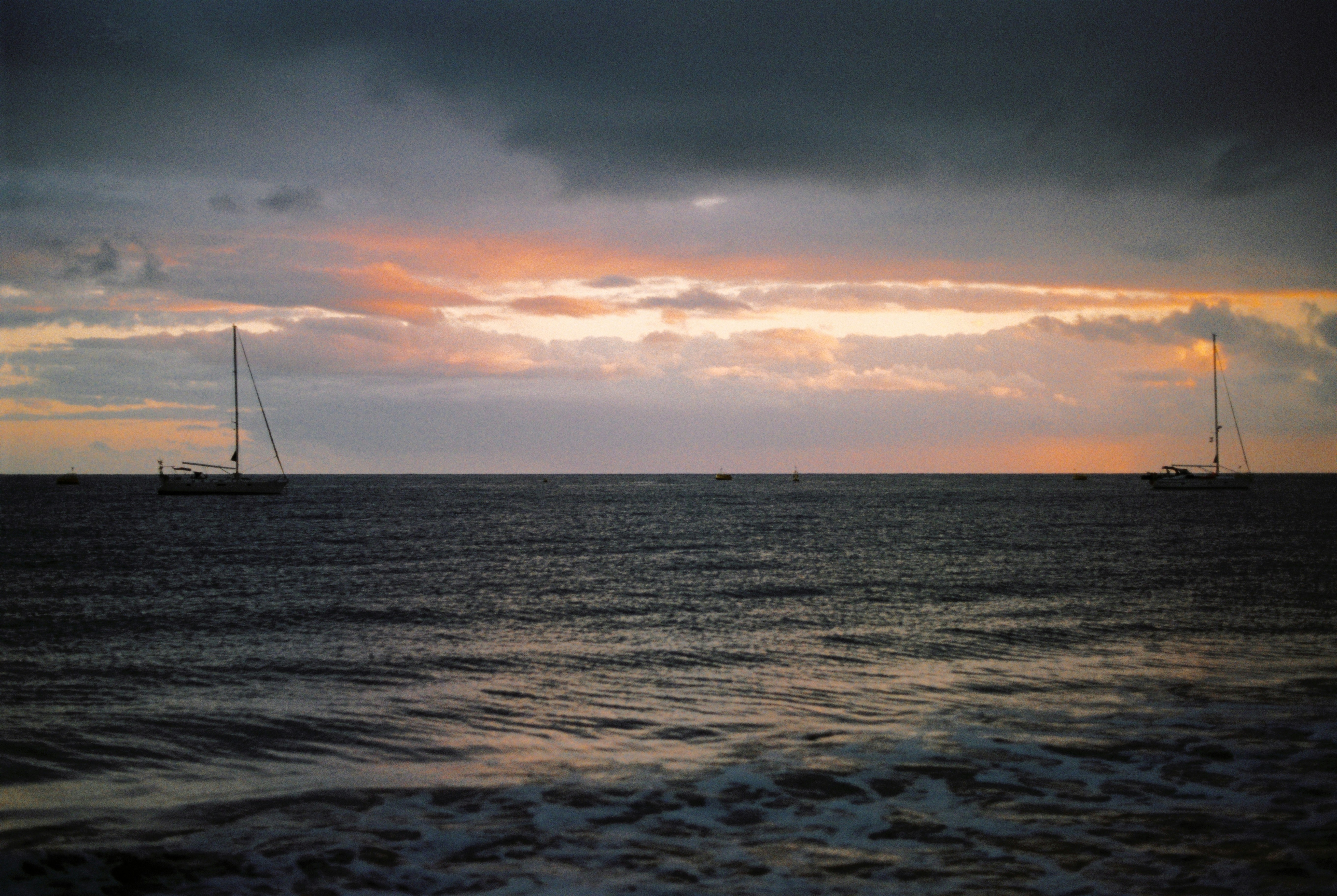 A couple of boats that are in the water