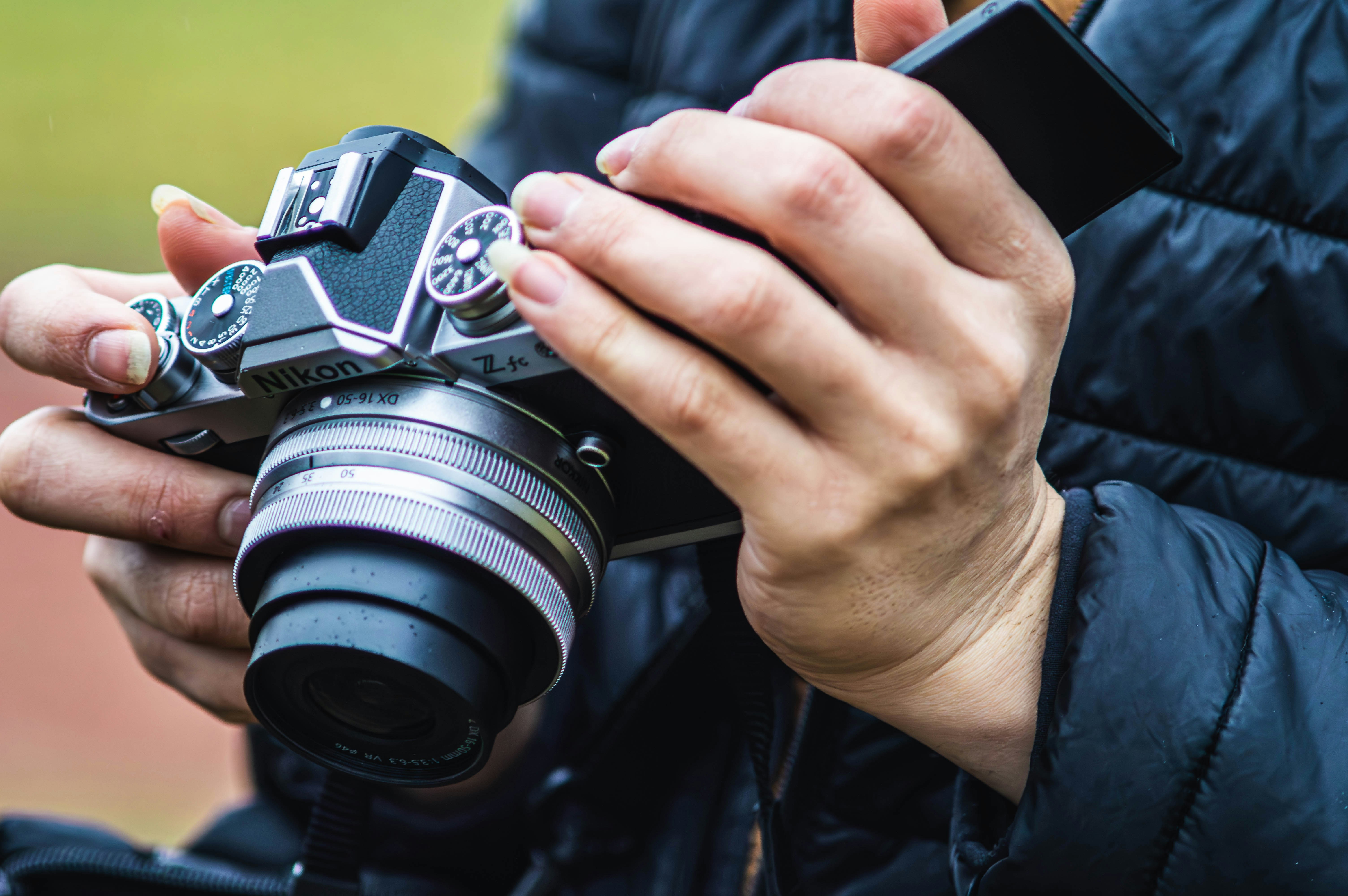 A person holding a camera in their hands