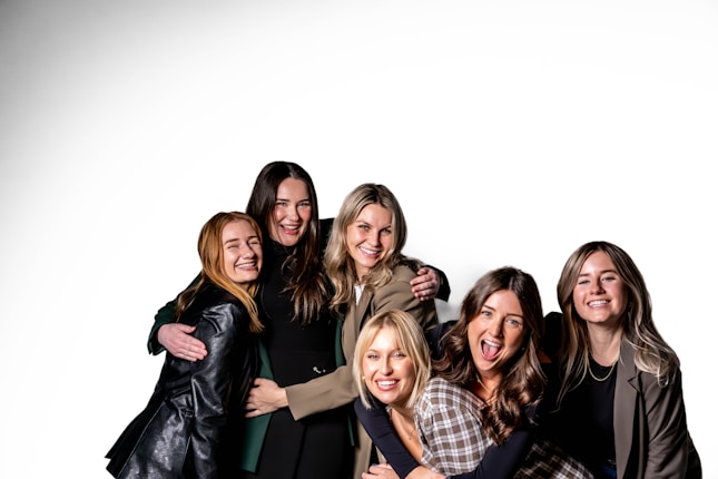 A group of women standing next to each other