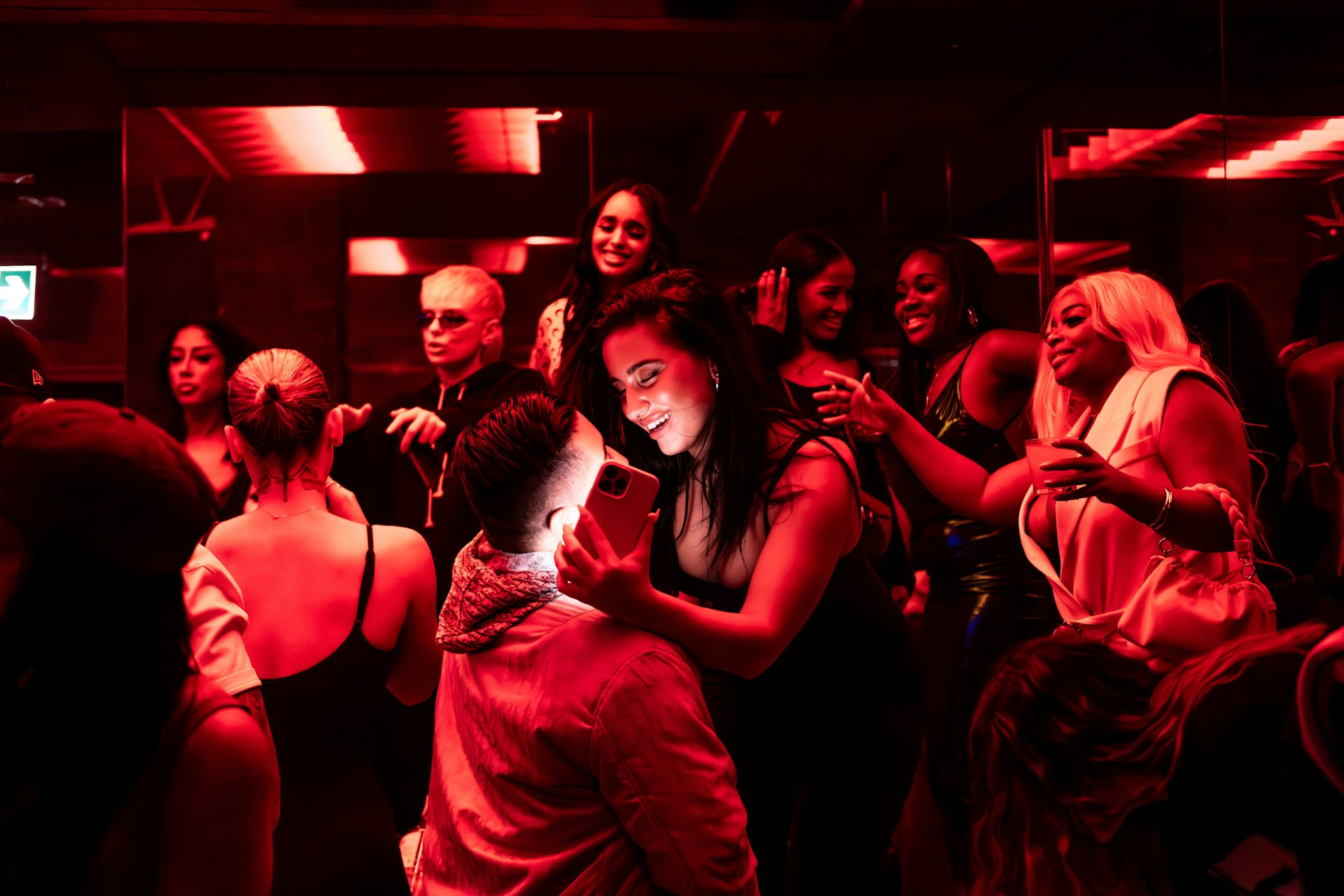 A group of people standing around each other