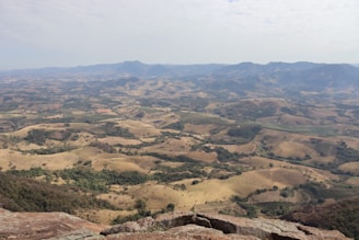 A view of a valley from the top of a mountain