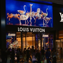 A group of people standing outside of a store