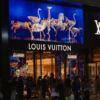 A group of people standing outside of a store