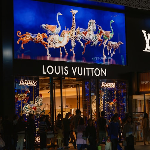 A group of people standing outside of a store