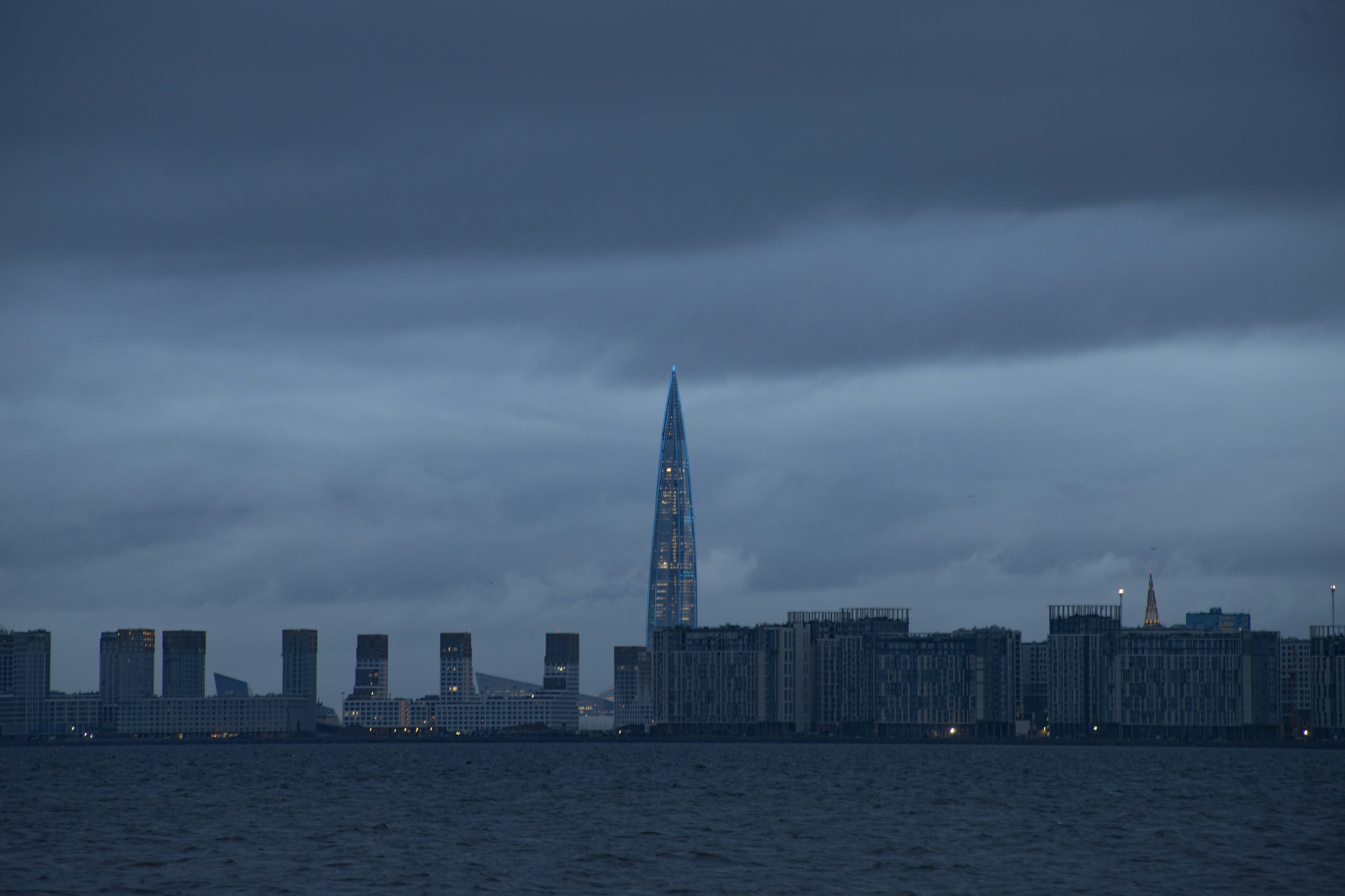 A large body of water with a city in the background