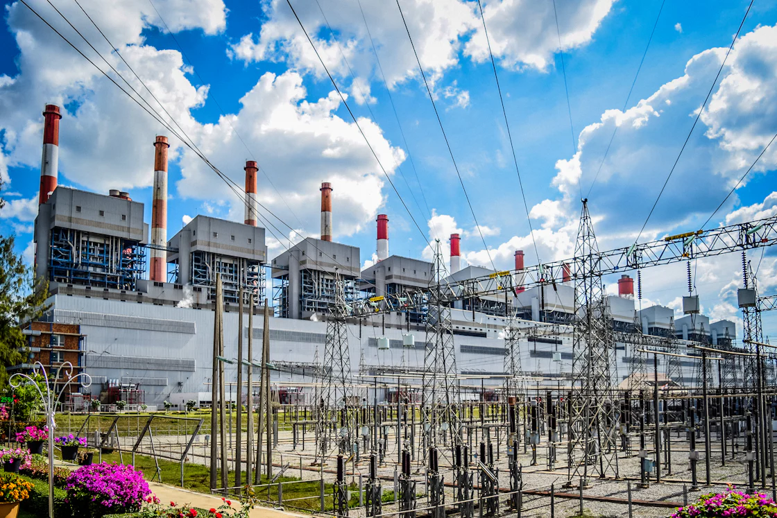 A power plant with high-voltage lines in front of it