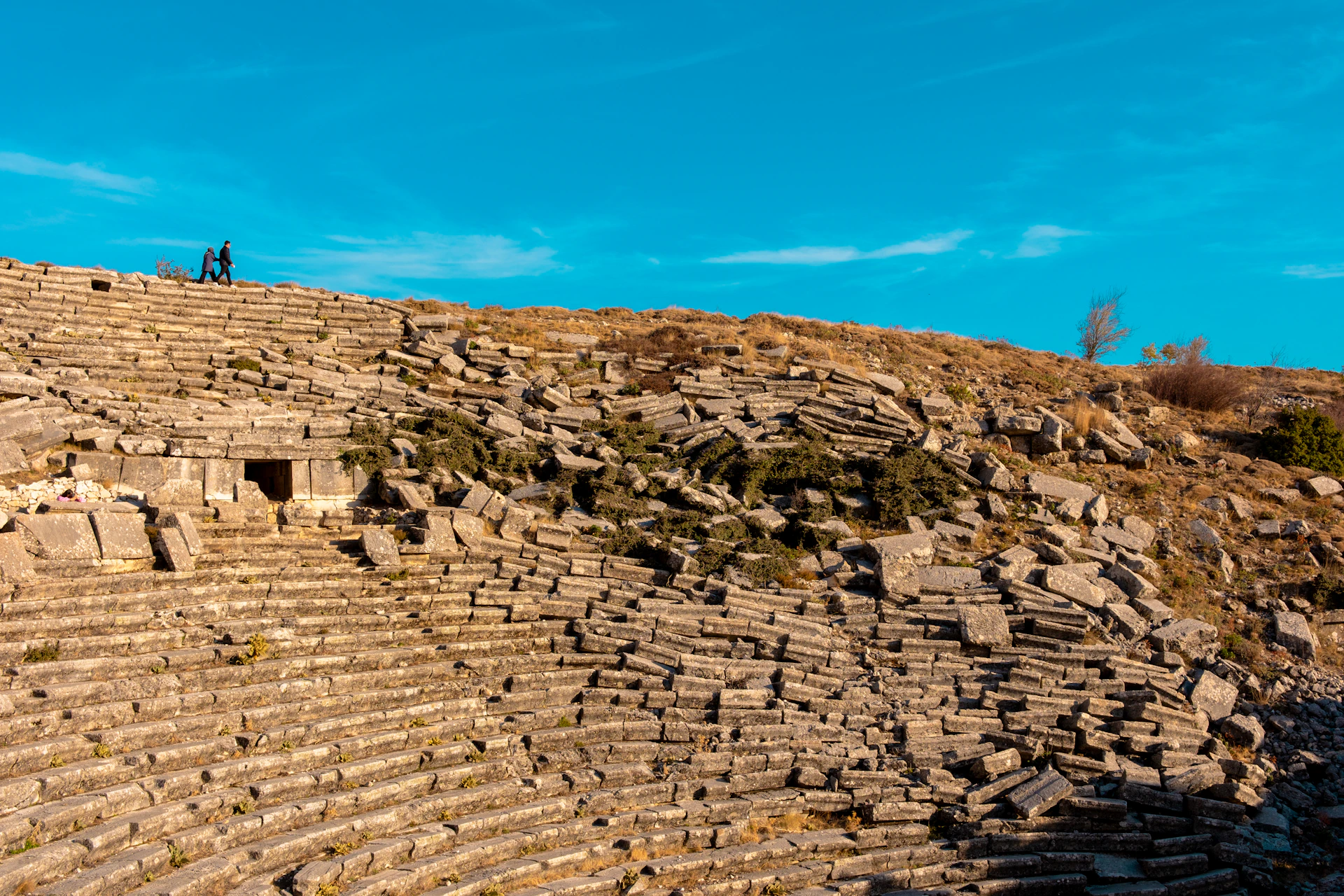 A large stone structure sitting on top of a hill