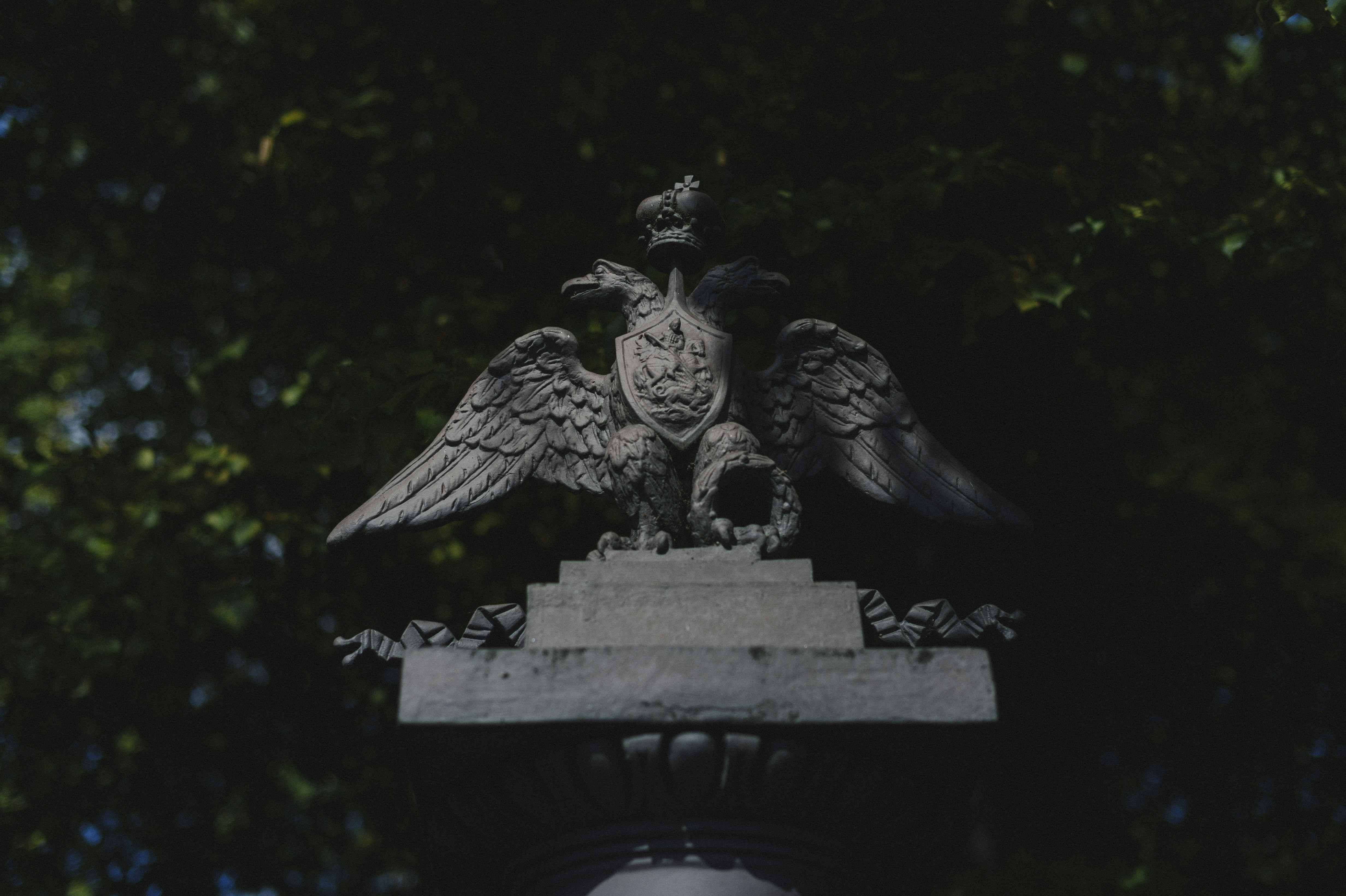 A statue of a bird on top of a building