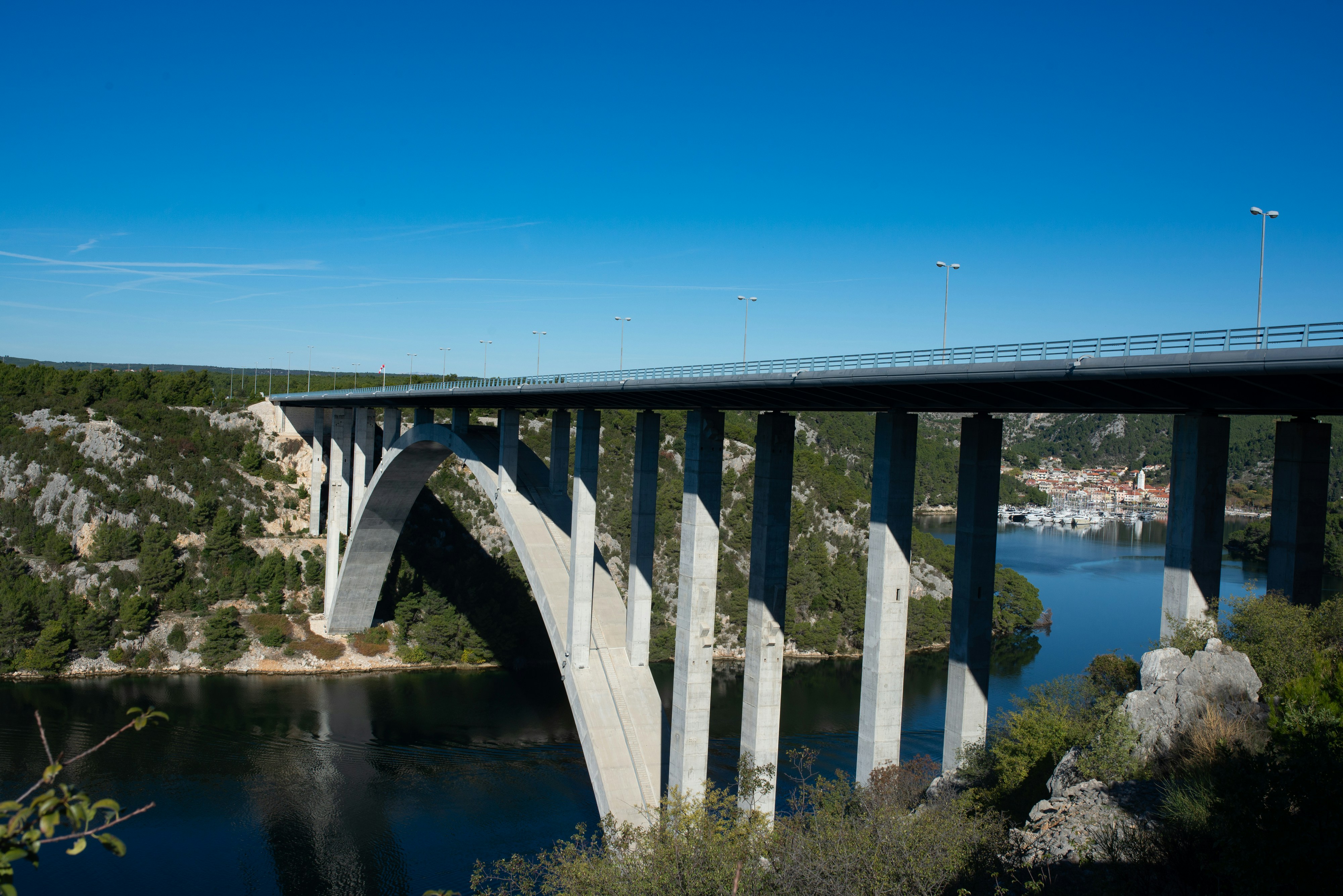 A bridge over a river with a blue sky in the background