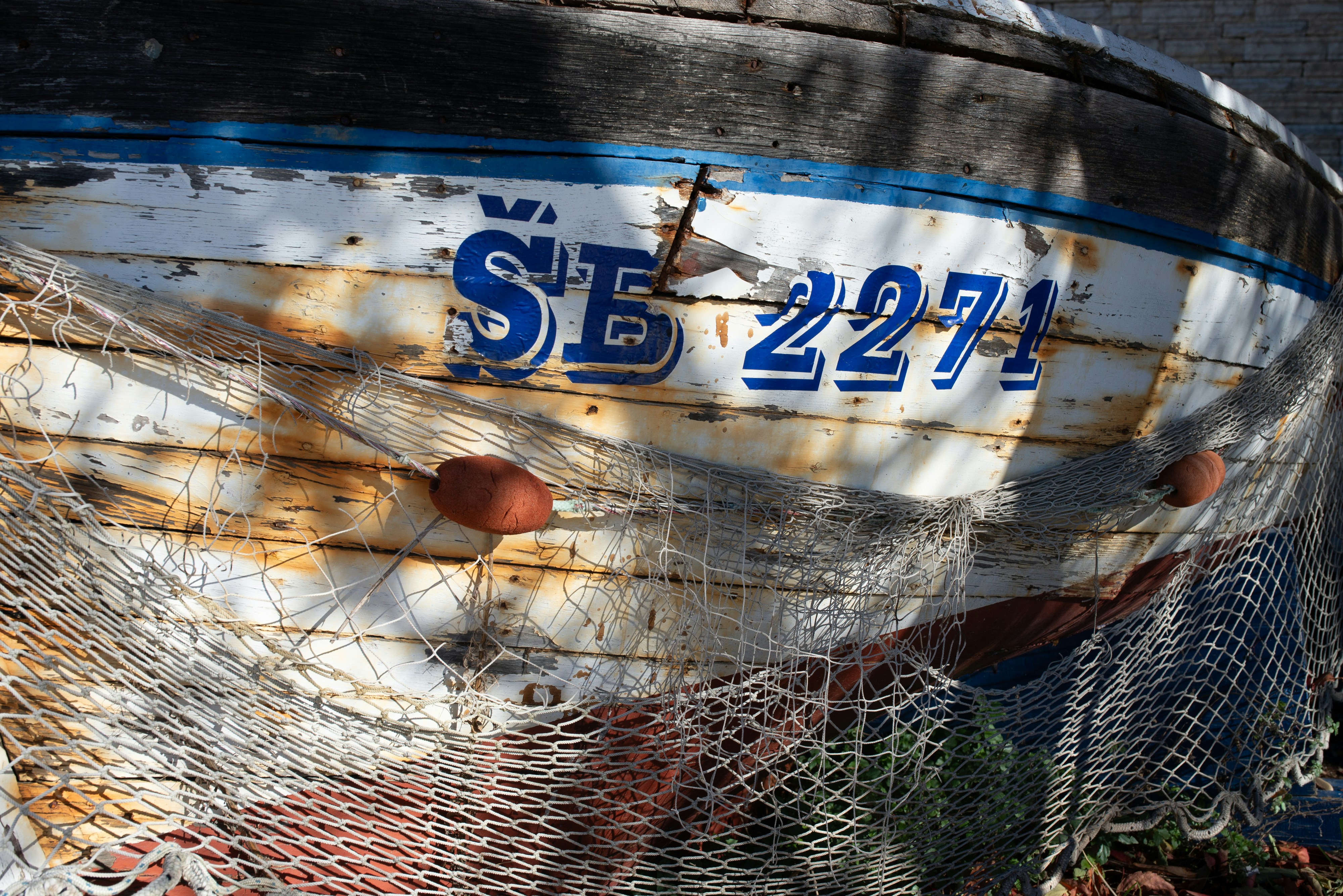 A boat that is sitting in the grass