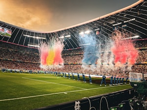 A stadium filled with lots of people watching a soccer game