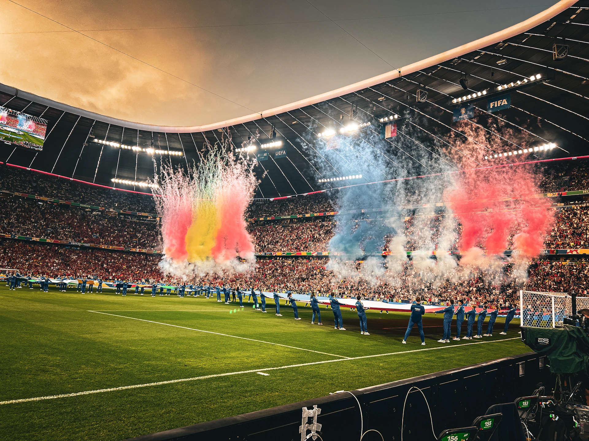 A stadium filled with lots of people watching a soccer game