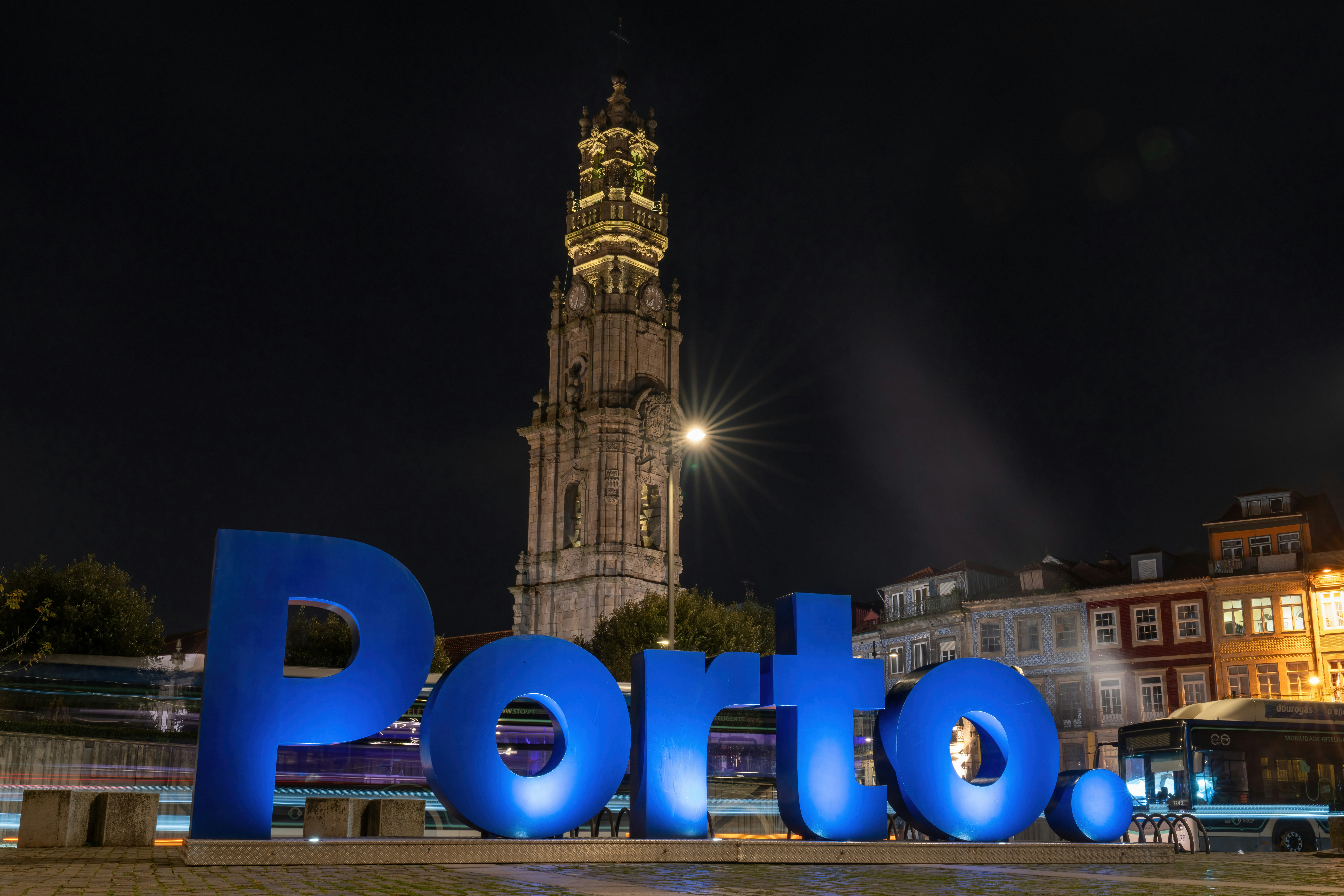 A large sign that says potato in front of a tall building