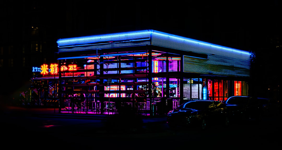 A lit up building in the dark at night,