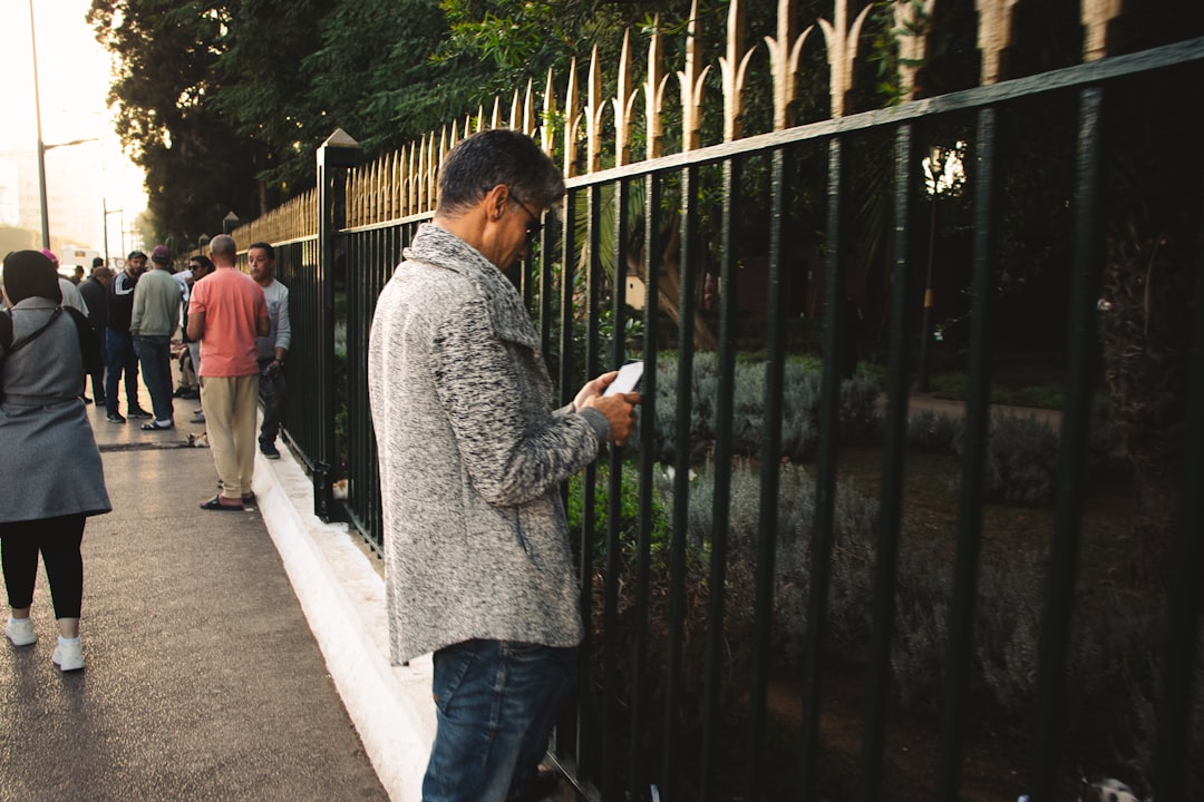 person checking phone for technician arrival - "Find me the best HVAC contractors in Miami that allow for convenient online booking and provide real-time service updates." person checking phone for technician arrival - "Find me the best HVAC contractors in Miami that allow for convenient online booking and provide real-time service updates."