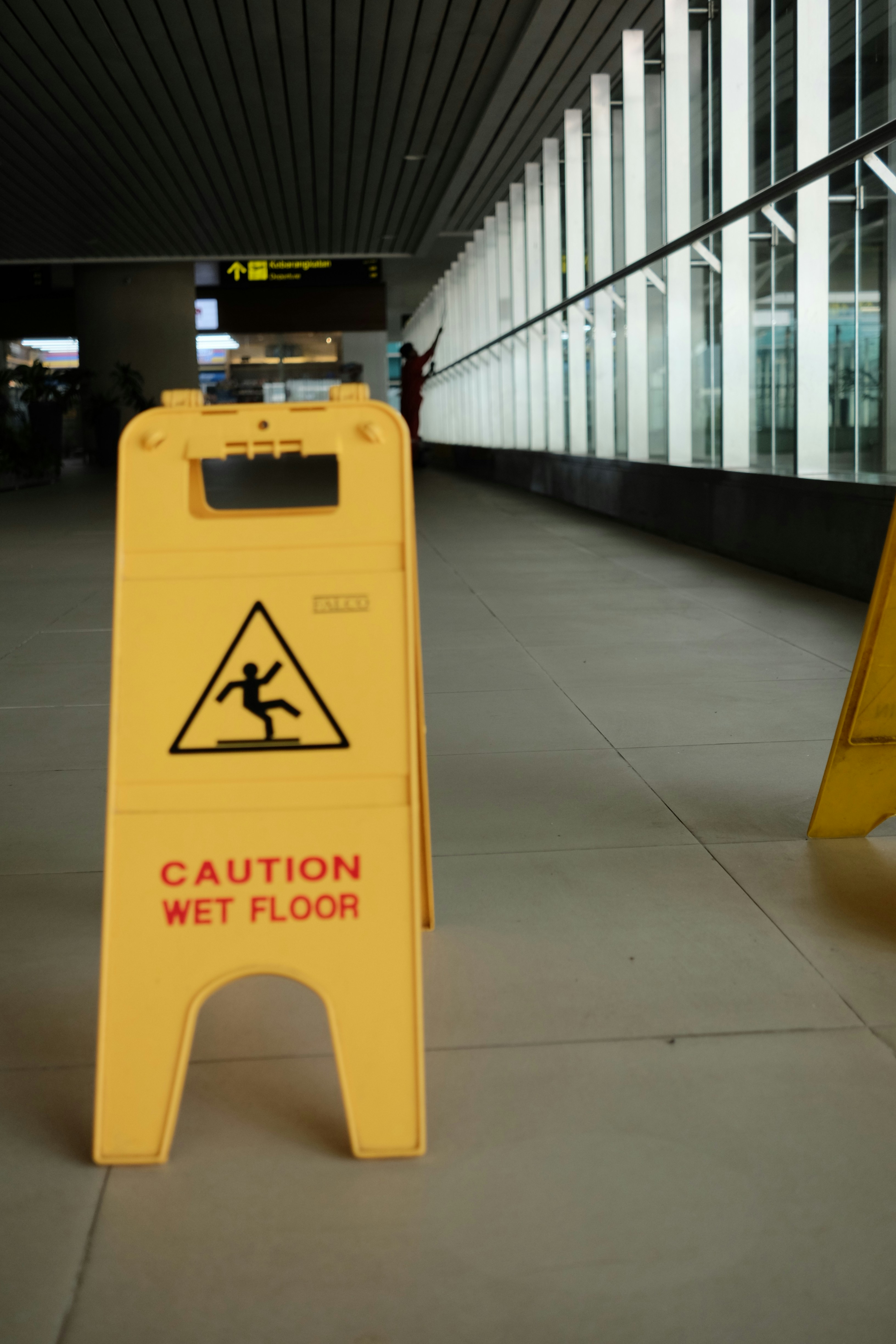 A caution wet floor sign in a building