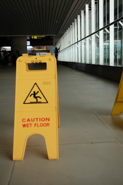 A caution wet floor sign in a building
