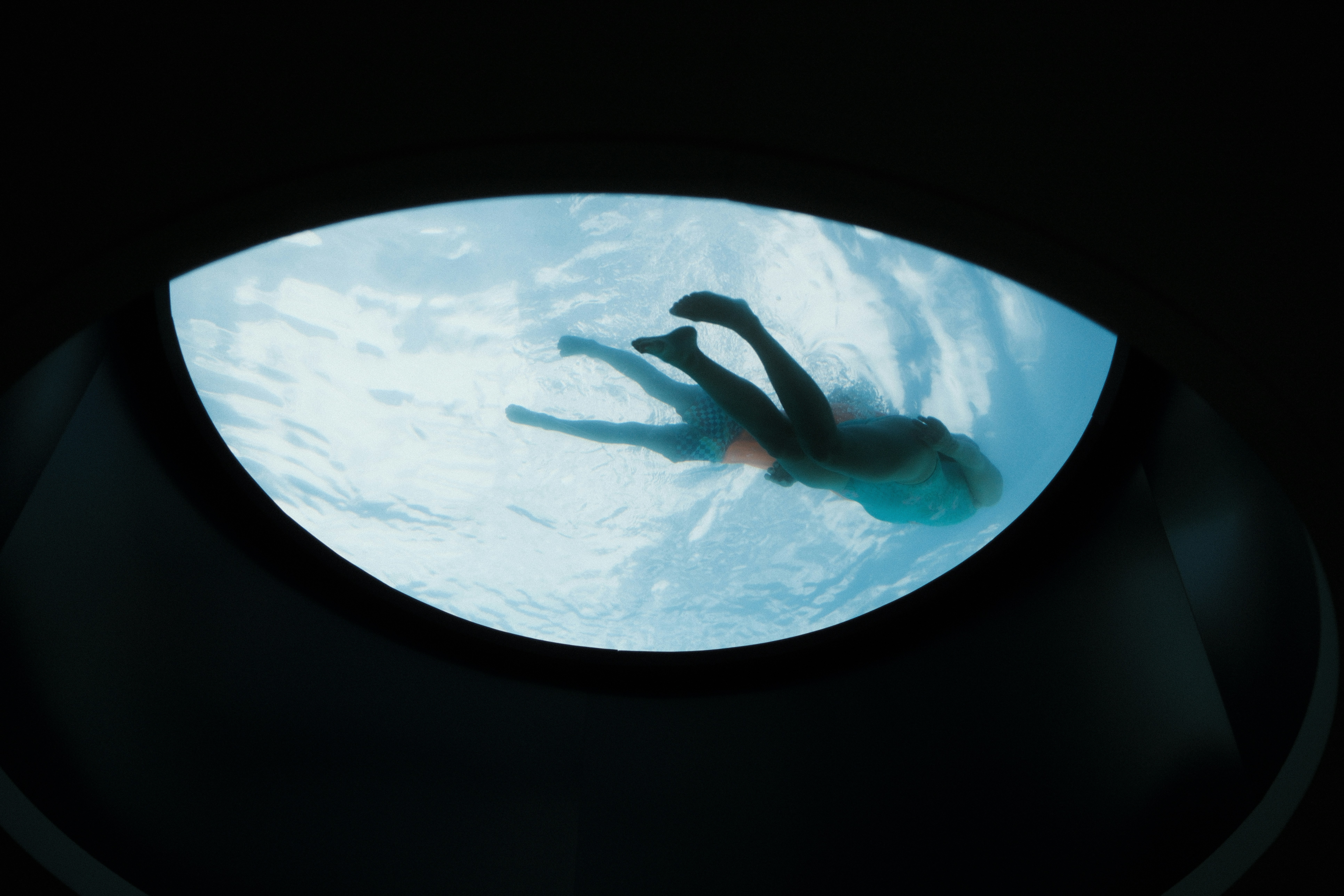 A person swimming in a pool of water