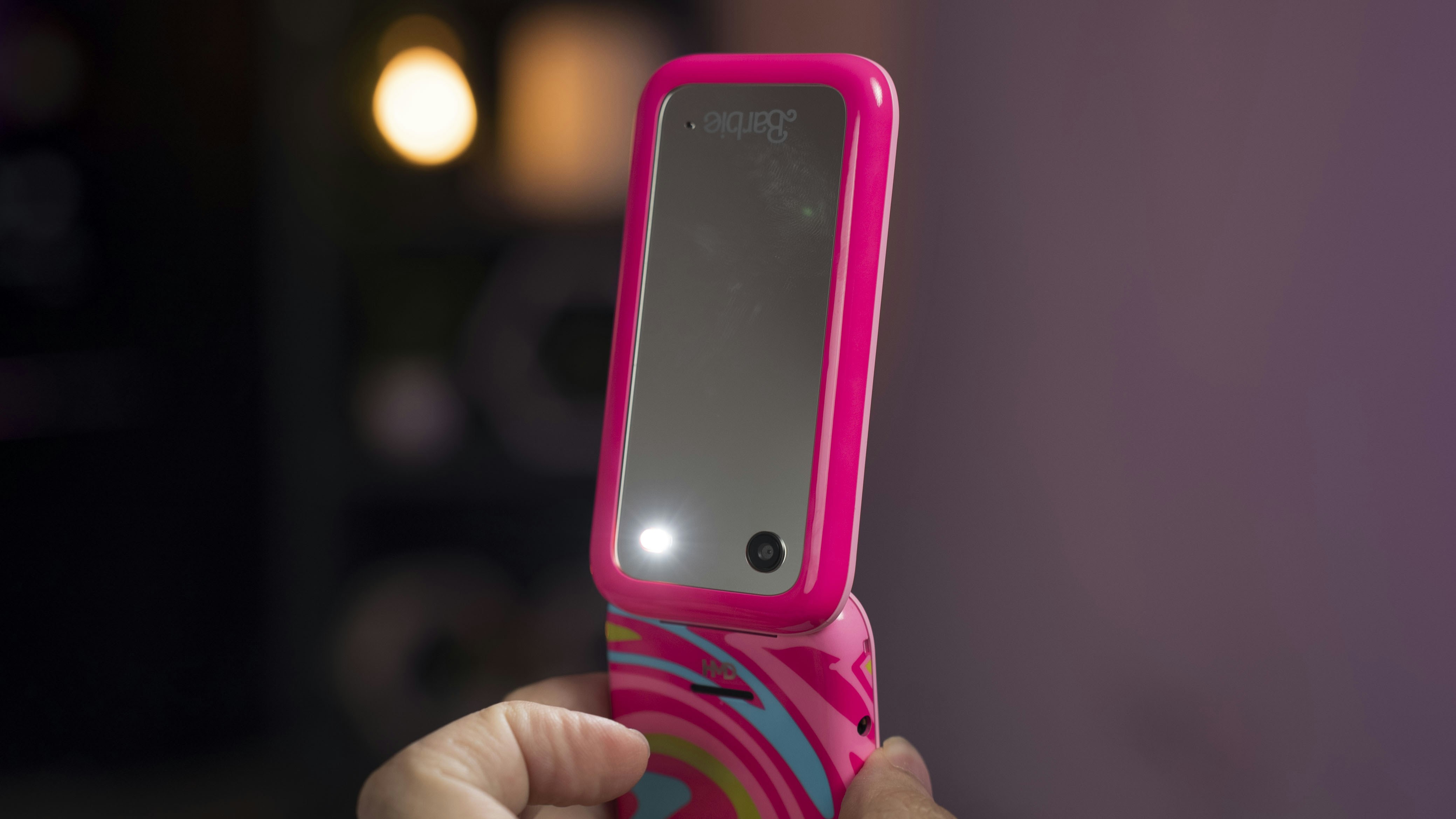 A person holding a cell phone in their hand