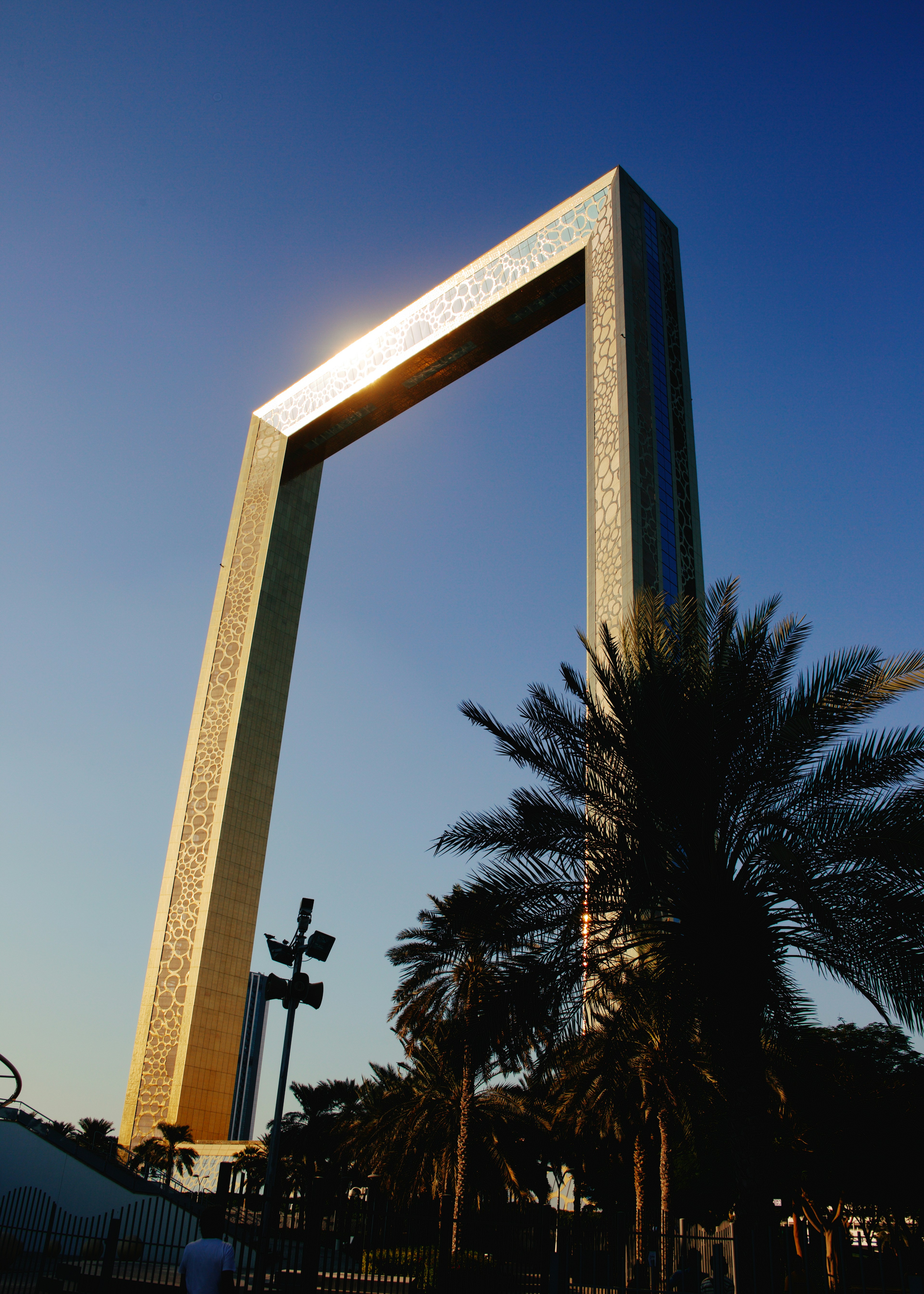 A tall monument with a light shining on top of it