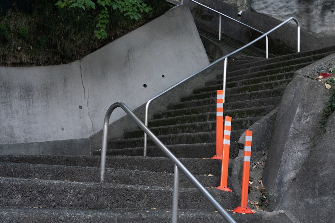 A man riding a skateboard down a set of stairs, Zigzag Staircase