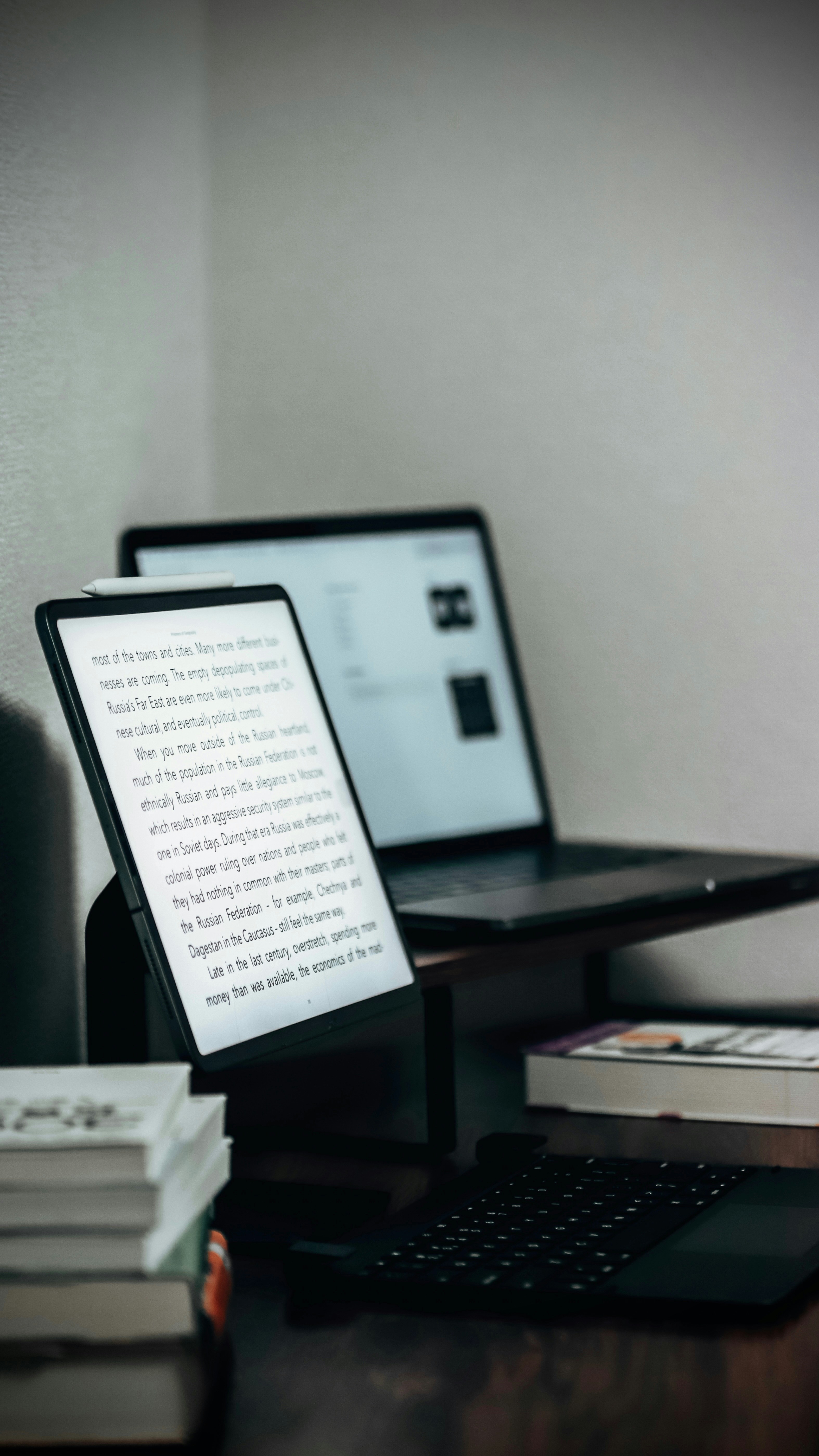 A laptop computer sitting on top of a wooden desk