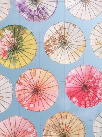 A bunch of umbrellas that are on a wall