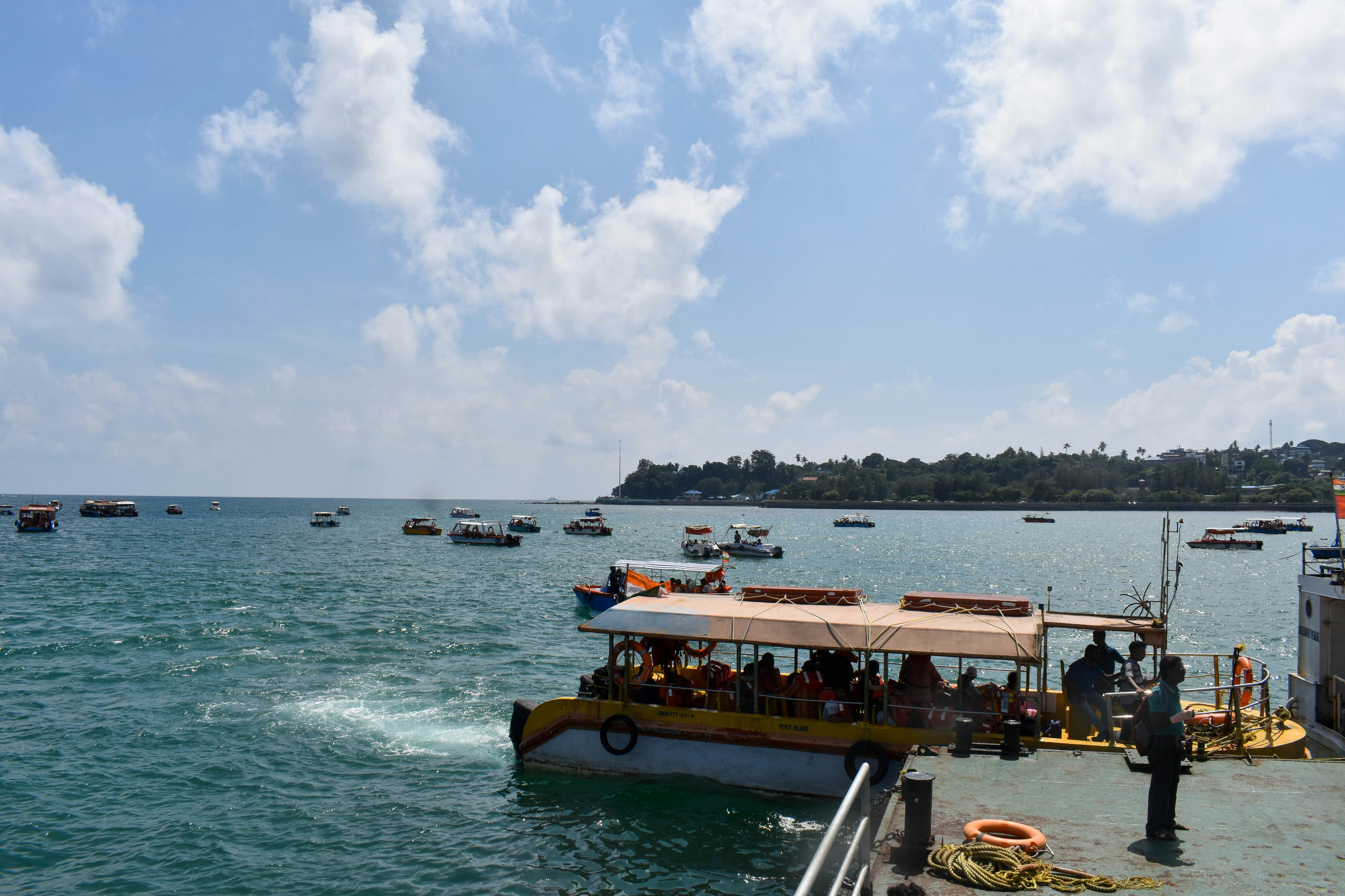 A group of people on a boat in the water photo – Free Sea Image on Unsplash