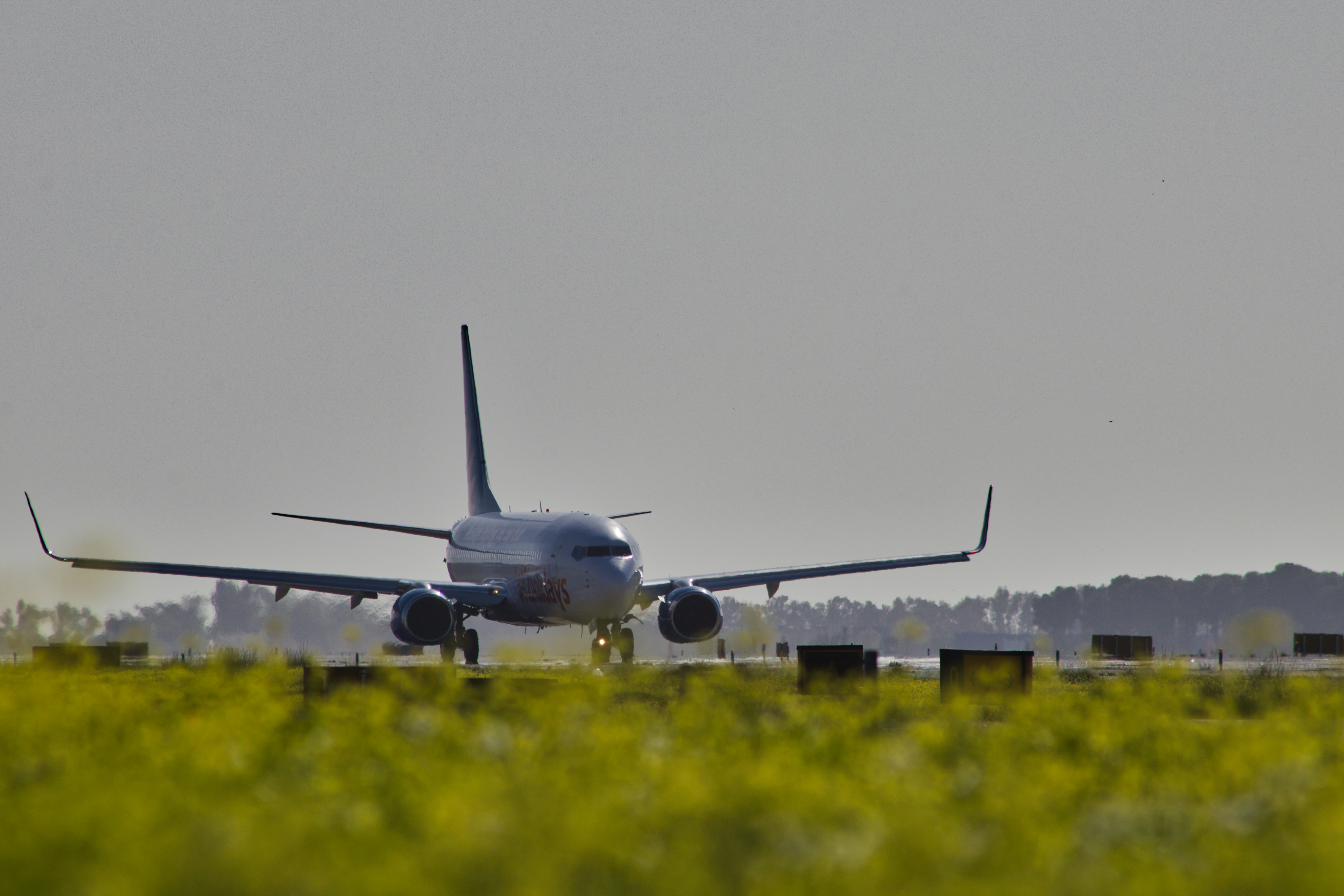 A large jetliner taking off from an airport runway
