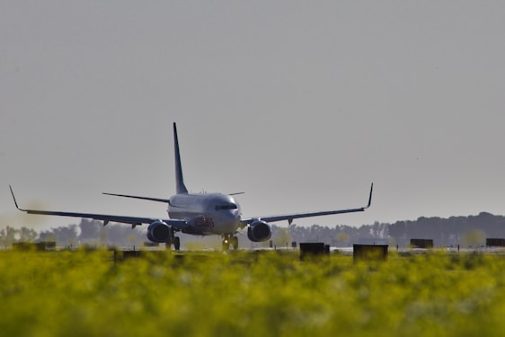 A large jetliner taking off from an airport runway