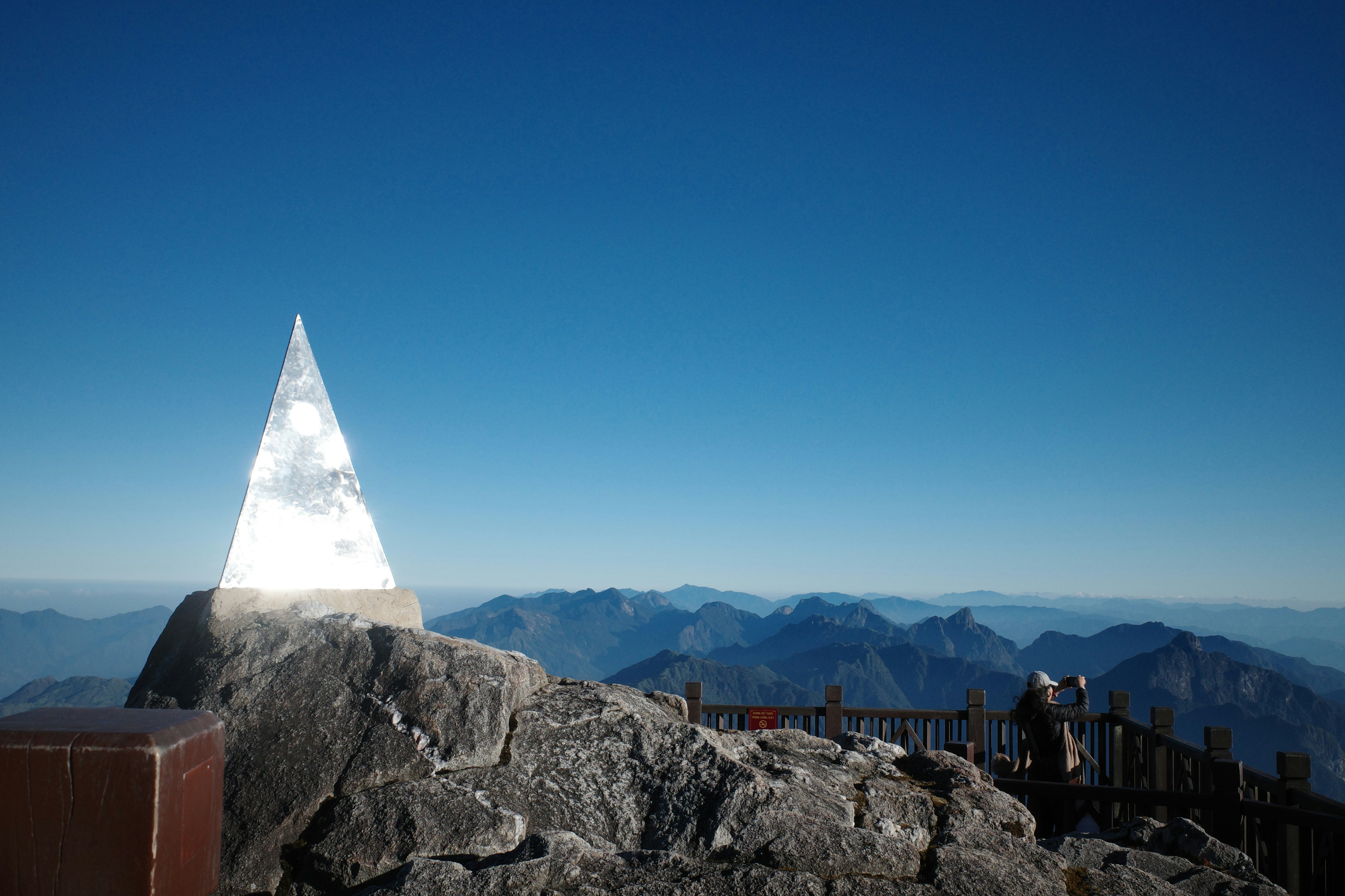 A person standing on top of a mountain