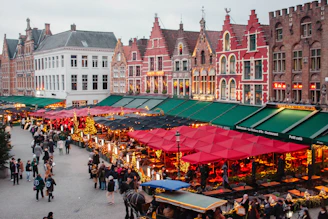 A group of people walking around a market