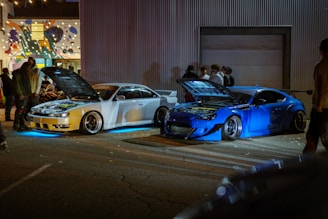 A group of cars parked next to each other in a parking lot