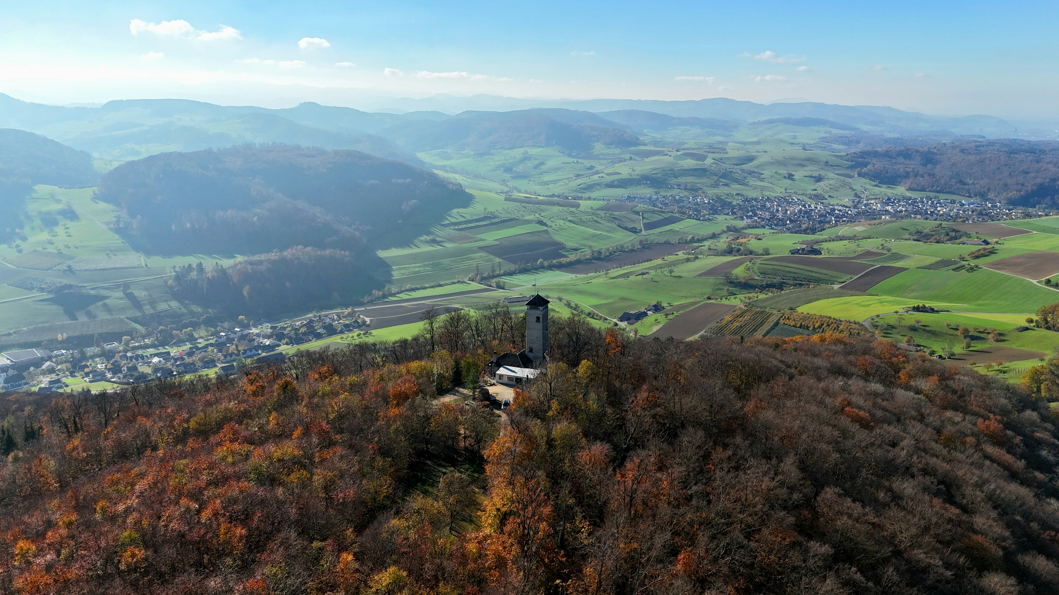 A bird's eye view of a small house on top of a hill