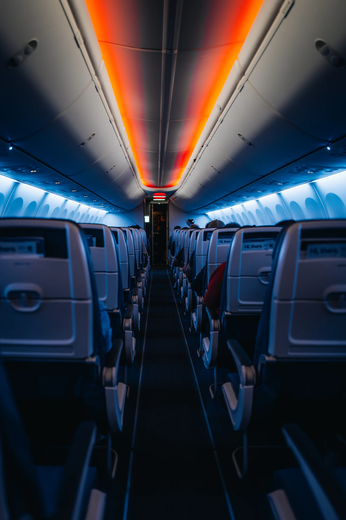 Rows of empty airplane cabin seats