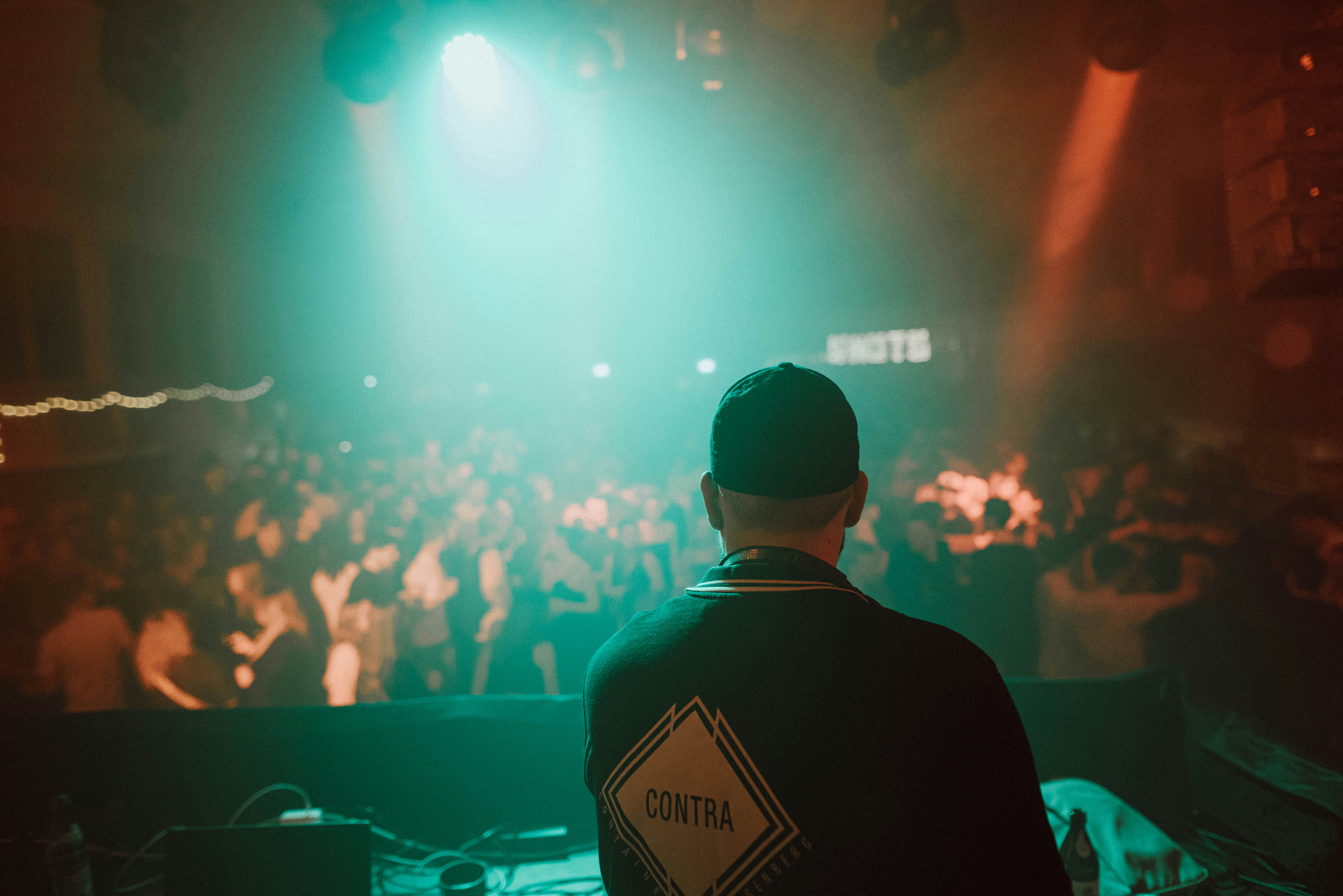 A man standing in front of a crowd at a concert